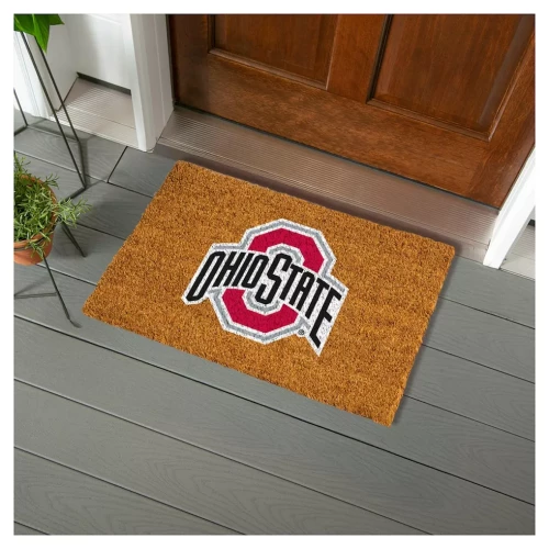 Doormat with an Ohio state logo on it on a the ground in front of a door 