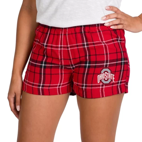 A person wearing red and black plaid flannel shorts featuring a white Ohio State Buckeyes script logo on the left leg.