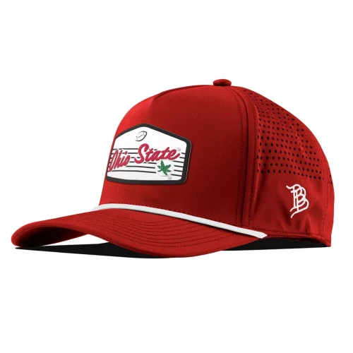 red hat with a white rope across with a white badge on the front