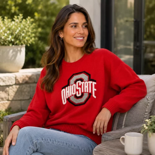 one model sits and wears a red sweatshirt with ohio state logo on the front 