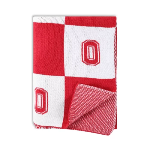 A red and white patterned Ohio State Buckeyes throw blanket featuring the block 