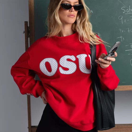 Red mock neck crewneck with “OSU” in white bubble letters, with polka dots inside the letters, in the center