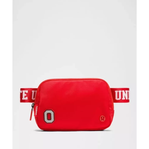 red belt bag with Ohio State logo on the bottom left against a white background.