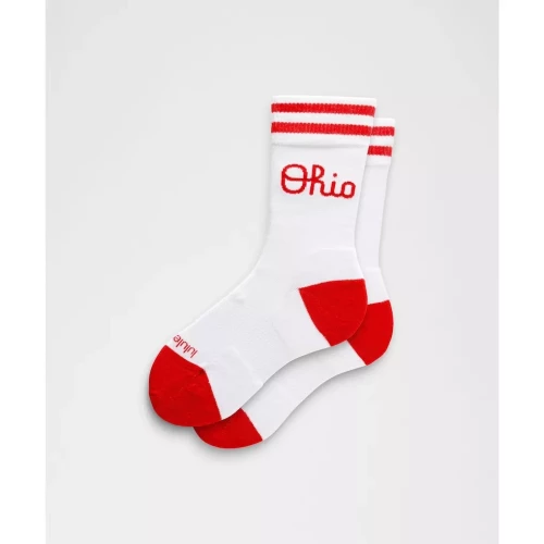 pair of red and white socks with script ohio logo 