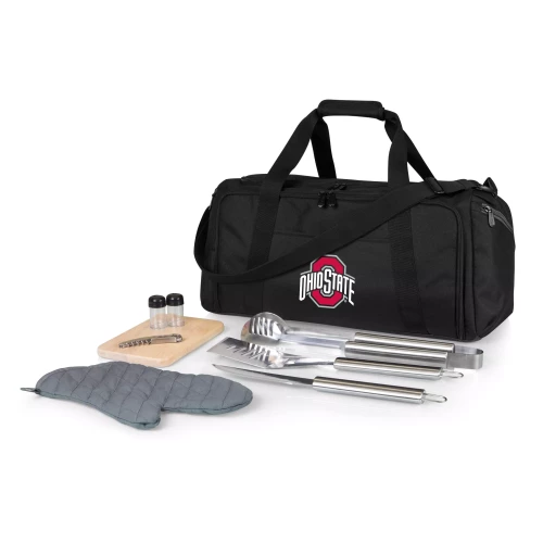 A black BBQ apron tote set featuring an adjustable neck strap, a front pocket with the Ohio State logo, matching a gray oven mitt, and stainless steel grilling tools including a spatula, fork, and tongs, against a clean white background.