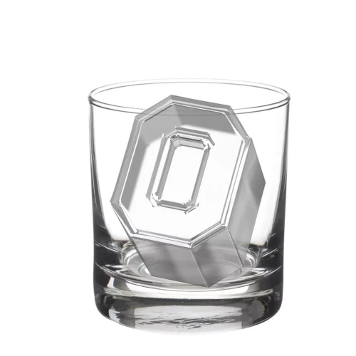 a block o shaped piece of ice sits in a clear rocks glass