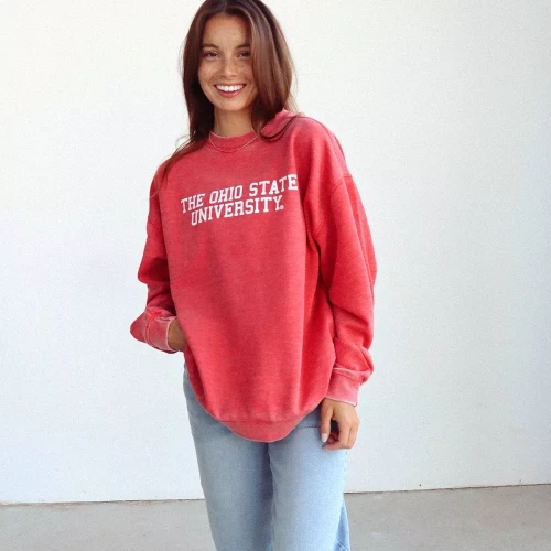 one model wears a red oversized crewneck with 