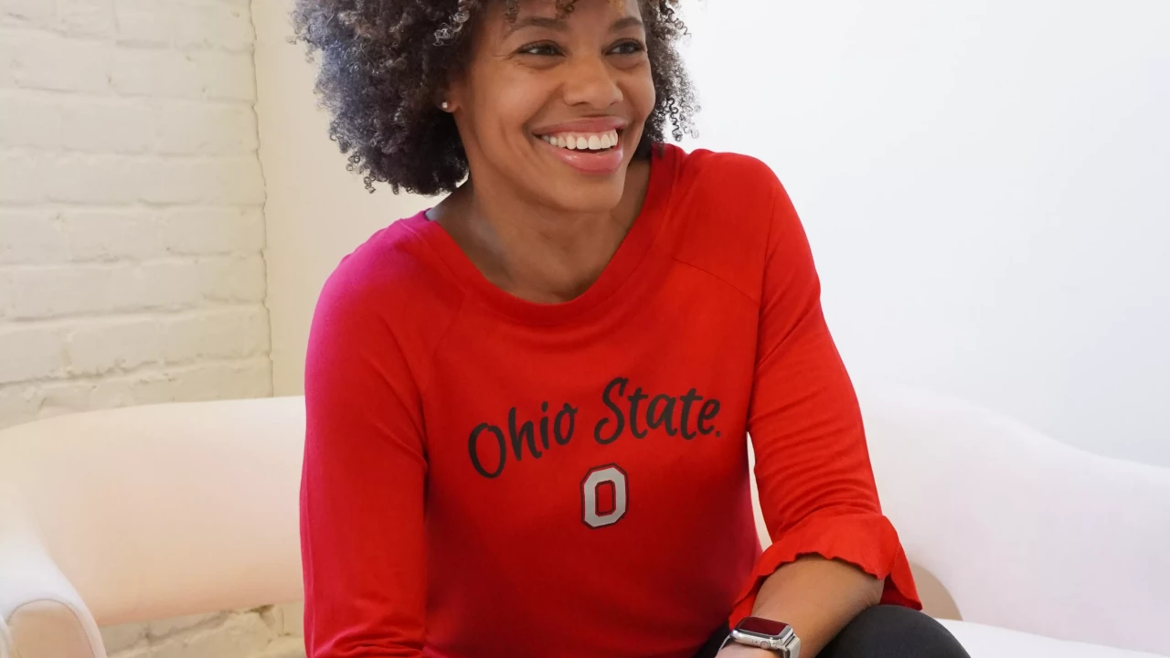 Model is wearing a red 3/4 flair sleeve tee-shirt with gray Block 