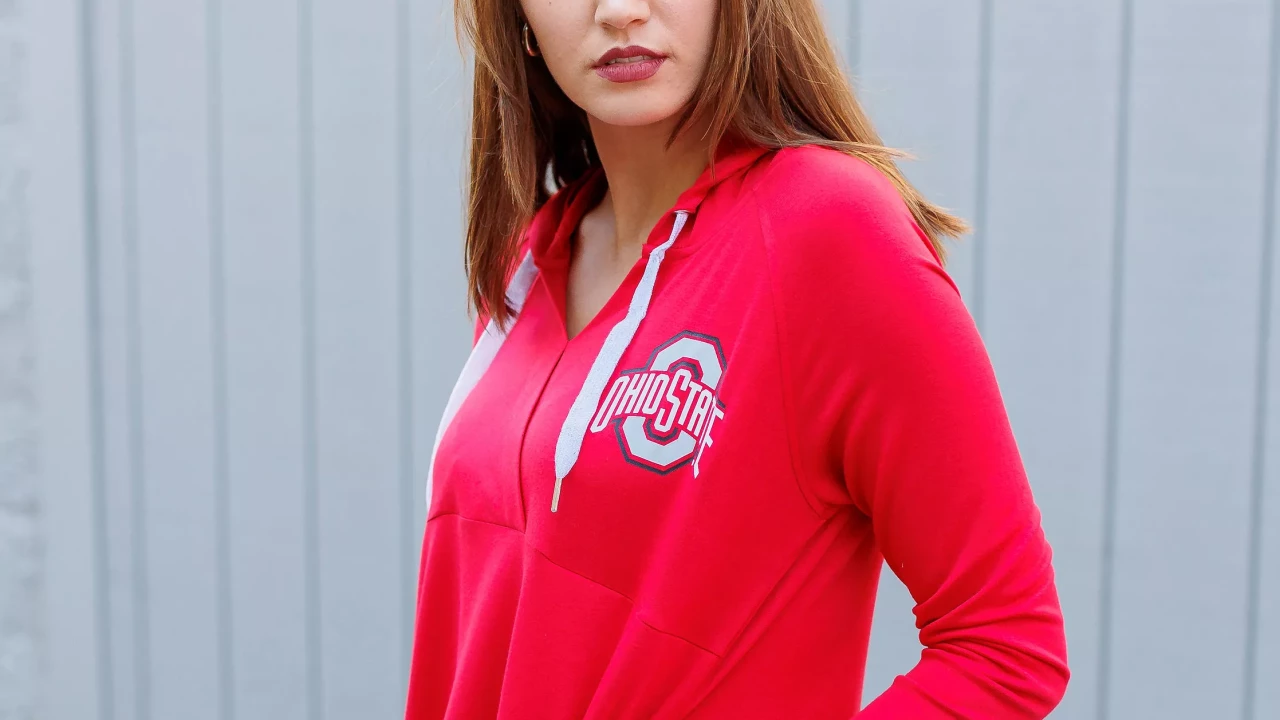 Model is wearing a red drawstring hoodie, with Ohio State Spirit Mark on right chest quadrant. 