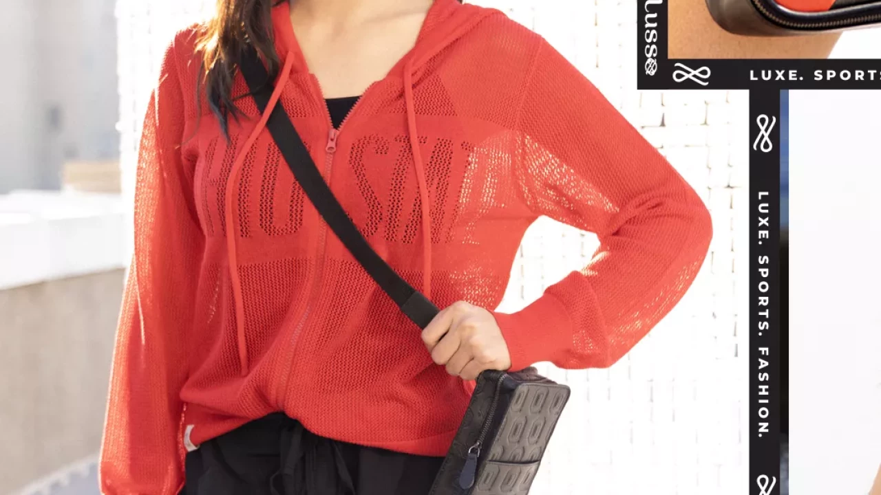 Model is wearing a red mesh draw string hoodie. With 