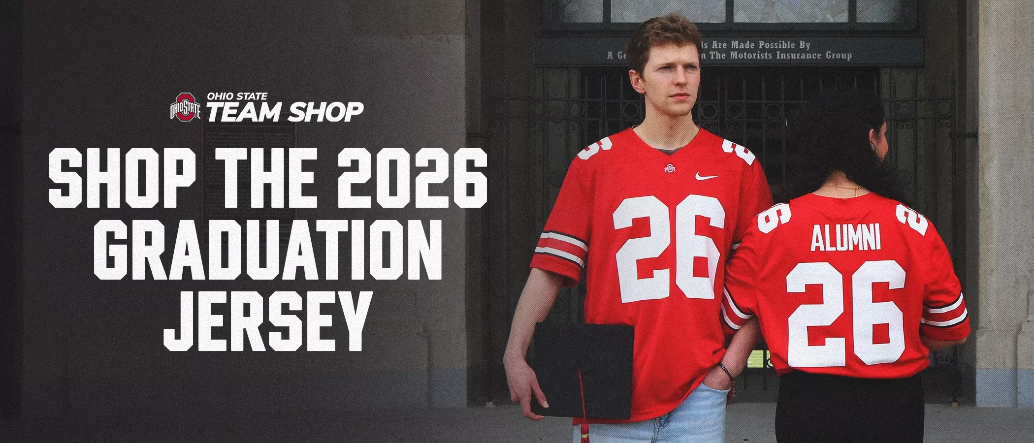 two models wearing red ohio state jersey, one facing the camera and one facing away, stand in front of the ohio stadium rotunda. both jerseys says the number 26 and 
